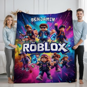 May include: A vibrant Roblox blanket with cartoon characters and the name "BENJAMIN" in white. The blanket's design is a mix of blues, purples, and pinks. A fun item for fans of the popular online game.
