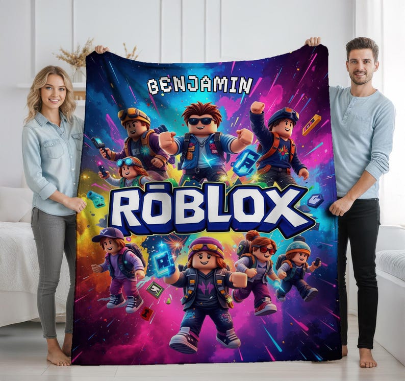 May include: A colorful Roblox-themed blanket featuring cartoon characters and the name "BENJAMIN" in white block letters. The blanket has a vibrant design with a mix of blues, purples, and pinks, perfect for fans of the popular online game.