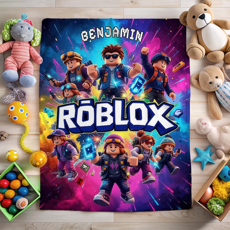 May include: A colorful blanket featuring a Roblox theme with the name "Benjamin" in pixelated text. The design includes Roblox characters against a vibrant background of blues, pinks, and purples. Soft toys surround the blanket.