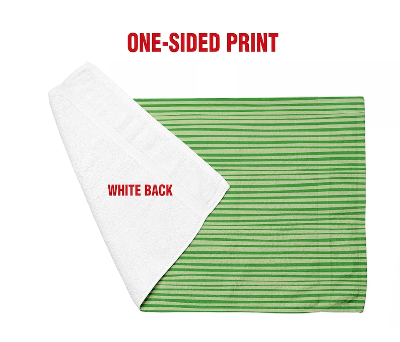 May include: A rectangular towel featuring a green and light green horizontal striped pattern on one side and a solid white texture on the reverse side. The text ONE-SIDED PRINT appears at the top and WHITE BACK is printed on the white section.