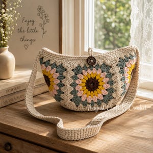 May include: A crocheted shoulder bag with a floral design. The bag features a beige base with colorful squares in shades of yellow, pink, and teal. A brown button secures the top flap. The strap is also crocheted in a matching beige color.