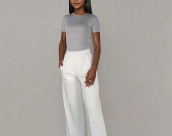 Elegant sweatpants with wide legs and pockets, women's, sporty, with a crease