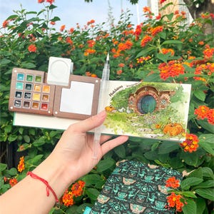 Conjunto de aquarela de viagem: 15 cores em paleta de nogueira com pincel