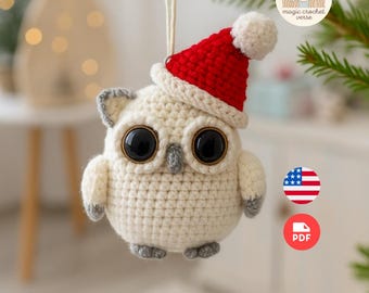 May include: A cream-coloured crocheted owl Christmas ornament, wearing a red Santa hat with a white pompom. The owl has large black eyes and grey detailing. It hangs from a green branch.