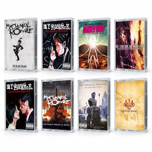 May include: A collection of eight My Chemical Romance music cassette tapes in clear plastic cases. The covers feature various album artworks including The Black Parade, Three Cheers for Sweet Revenge, Danger Days, Bullets, Life on the Murder Scene, The Black Parade Is Dead, May Death Never Stop You, and Conventional Weapons.