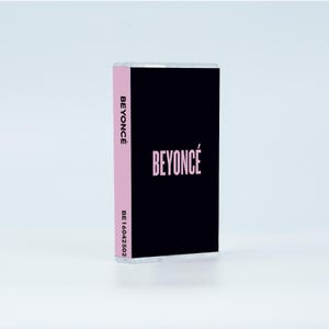 May include: A cassette tape with a black cover featuring the word BEYONC&Eacute; in light pink lettering. The side spine is light pink with the word BEYONC&Eacute; printed in black vertically, followed by the alphanumeric code BE16042502 in black text.