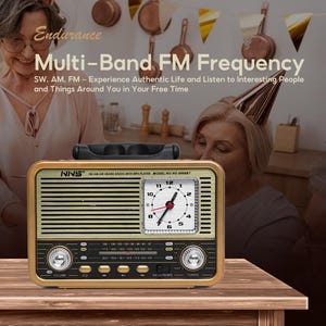 May include: A retro-style radio with a clock face, gold and black detailing, and the text "Multi-Band FM Frequency." The radio features volume and tuning controls, and a handle. The clock displays the time.