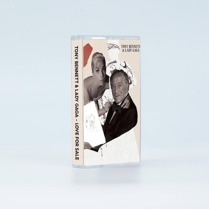 May include: A cassette tape case featuring the album Love for Sale by Tony Bennett and Lady Gaga. The cover art displays a collage of black and white photographs of the two artists, with the text Tony Bennett & Lady Gaga printed on the side.