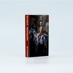 May include: A cassette tape case featuring the Renaissance album cover art. The spine displays the text BEYONC&Eacute; - RENAISSANCE and BE16042503. The cover image depicts a person in a white cowboy hat riding a metallic, reflective horse against a dark background.