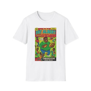 May include: White t-shirt with a comic book-style graphic of Fat Albert and the Cosby Kids. The design shows Fat Albert holding a football, surrounded by other characters. The text "Fat Albert and the Cosby Kids" is prominently displayed.