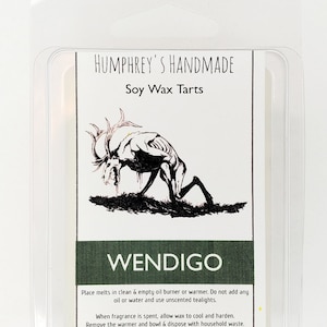 May include: A white label with black text that reads "HUMPHREY'S HANDMADE Soy Wax Tarts" and a black and white illustration of a creature with antlers. The label also has green text that reads "WENDIGO" and instructions for using the wax melts.