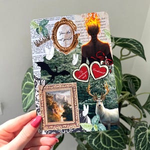 May include: A rectangular collage card featuring a figure with flaming hair, a gold-framed mirror with the text You do not yield, a landscape painting in a gold frame, a white deer, a black dragon silhouette, and two red hearts labelled To whatever end and Fireheart.