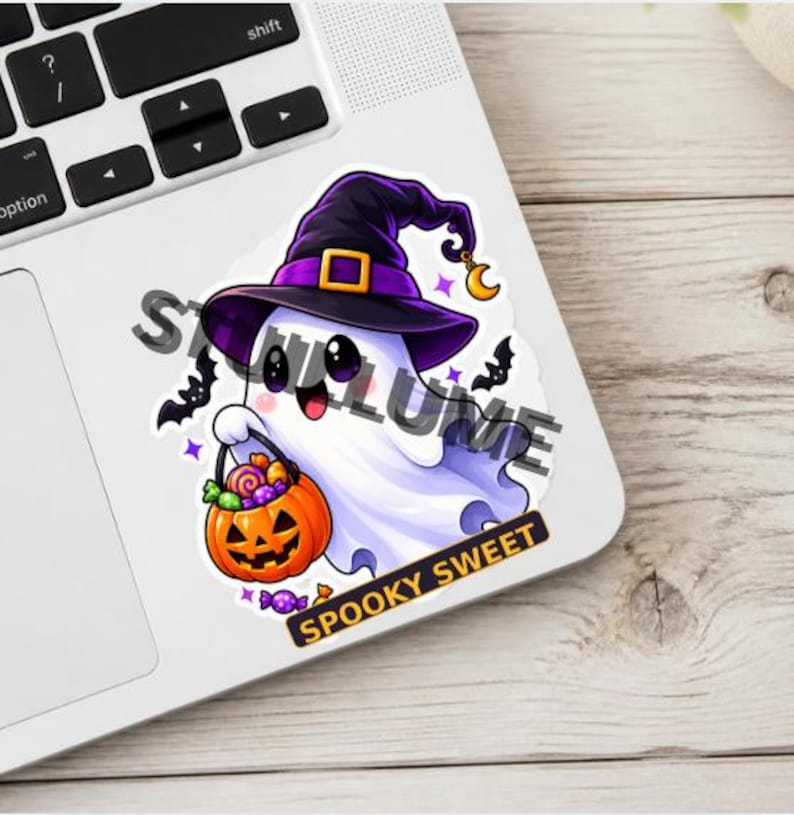 May include: A die-cut sticker featuring a white ghost wearing a purple witch hat with a gold buckle and a crescent moon charm. The ghost holds an orange jack-o'-lantern bucket filled with colorful candies. The text SPOOKY SWEET is printed below.