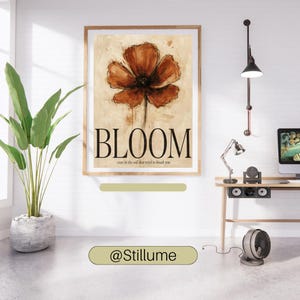May include: A rectangular wall art print featuring a large, painterly rust-orange flower centred on a beige background. The word BLOOM is printed in large black serif letters below the flower, with the text even in the soil that tried to break you.