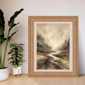Puede incluir: Un cuadro de paisaje enmarcado que muestra un r&iacute;o serpenteante a trav&eacute;s de un valle monta&ntilde;oso y brumoso en tonos beige, marr&oacute;n y gris. La obra est&aacute; encerrada en un marco dorado, ornamentado y texturizado con un borde de paspart&uacute; claro.