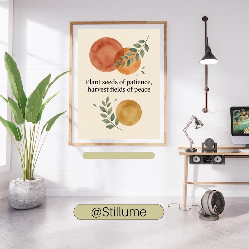 May include: A framed wall art print featuring a cream background with three watercolour circles in shades of orange and gold, accented by green leafy branches. The text reads: Plant seeds of patience, harvest fields of peace. The brand name @Stillume is visible.
