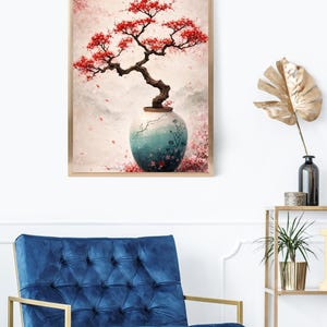 May include: A framed art print featuring a bonsai tree with vibrant red blossoms. The tree is planted in a teal and white vase with floral designs. The background has a soft, blurred effect with pink and white tones, creating a serene and artistic aesthetic.