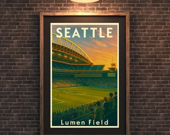 May include: A framed poster featuring a stadium scene with the text "SEATTLE" at the top and "Lumen Field" at the bottom. The image depicts a sports stadium with a green field, seating areas, and a vibrant sunset sky.