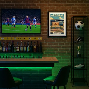 May include: A sports bar interior with a brick wall, a TV showing a soccer game, and an "Arsenal Emirates" framed print. A black shelving unit displays a soccer ball, cleats, and a trophy. A bar with green lighting and bar stools is in the foreground.