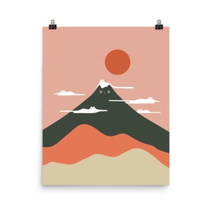 May include: A digital illustration of a mountain with a cat face, surrounded by white clouds. The mountain is green and the background is pink with an orange sun.