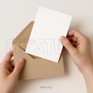 May include: A blank white card being inserted into a brown envelope. The envelope is open, and the card is held by two hands. The background is a solid, neutral color. The text "BASE FILE" is at the bottom of the image.