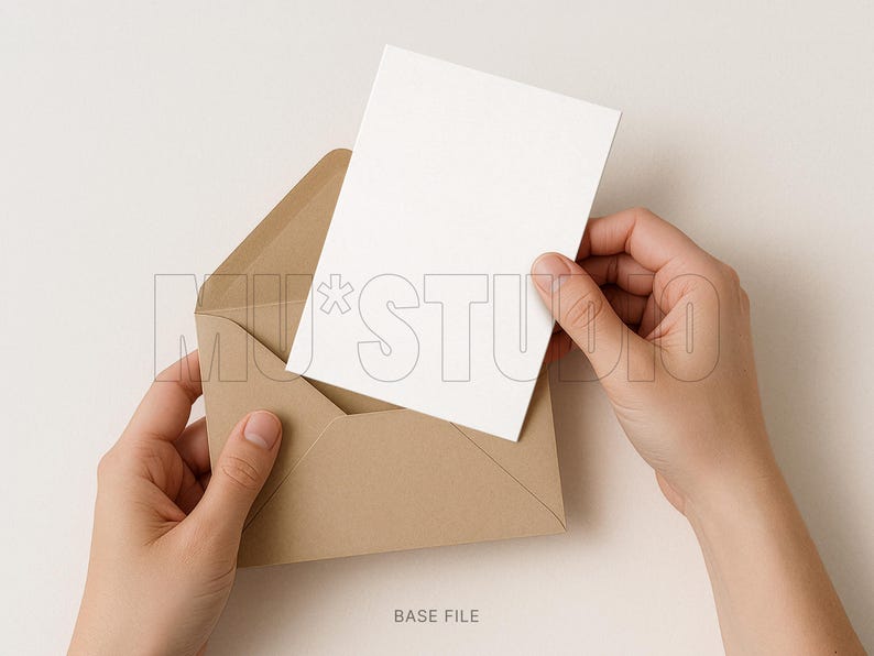 May include: A blank white card being inserted into a brown envelope. The envelope is open, and the card is held by two hands. The background is a solid, neutral color. The text "BASE FILE" is at the bottom of the image.
