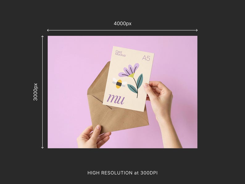 May include: A5 card mockup with a floral and bee illustration, held in a brown envelope against a light purple background. The card features a purple flower, green leaves, and the word "mu".