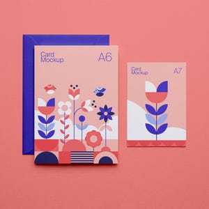 May include: A6 and A7 card mockups with floral designs in red, blue, and white. The A6 card is paired with a blue envelope. The cards feature the text "Card Mockup". The background is a solid coral color.