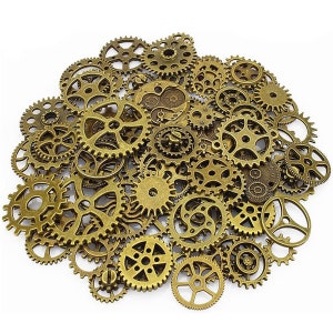 May include: A large collection of antique gold-toned metal gears of various sizes. The gears are arranged in a random pattern, creating a visually appealing and intricate design.
