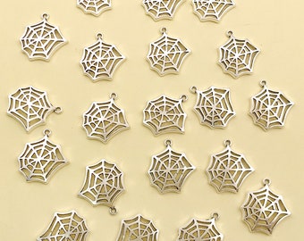May include: Twenty silver-toned metal charms shaped like spiderwebs. The charms have a loop at the top for attaching to jewellery or other crafts.