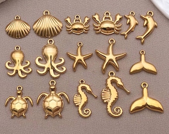 5 piezas de dijes dorados de océano, dijes de vida marina, dijes de concha de estrella de mar, colgantes para hacer pendientes, pulseras y joyas de Navidad, suministros para manualidades.