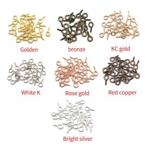 May include: Assortment of screw-back earring findings in various finishes, including golden, bronze, KC gold, white K, rose gold, red copper, and bright silver.