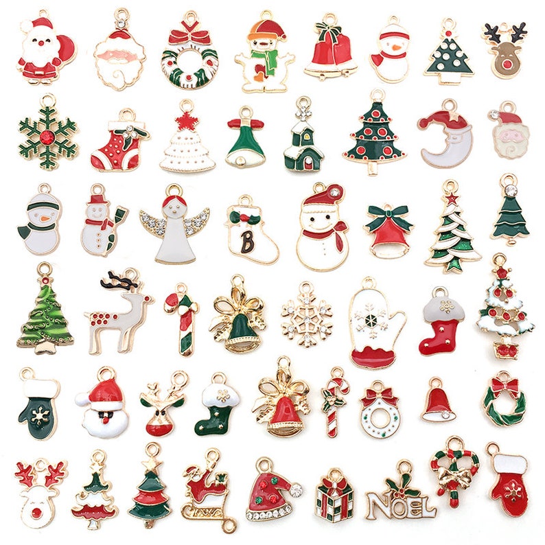 May include: Assortment of gold-tone Christmas charm pendants featuring various holiday themes, including snowmen, reindeer, candy canes, Christmas trees, Santa Claus, and ornaments.