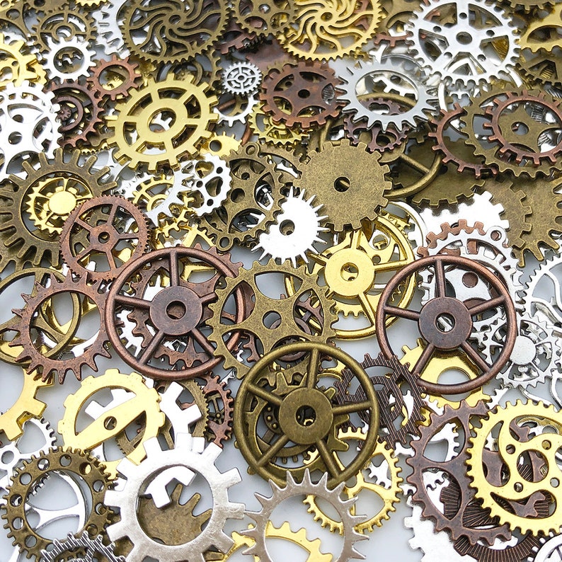 May include: A collection of antique-style metal gears in various sizes and shapes. The gears are made of brass and copper and have a distressed finish. They are perfect for crafting and steampunk projects.