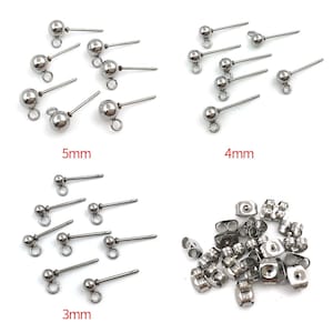 May include: Assortment of silver-toned earring findings in three sizes: 3mm, 4mm, and 5mm. The findings are made of stainless steel and have a smooth, polished finish.