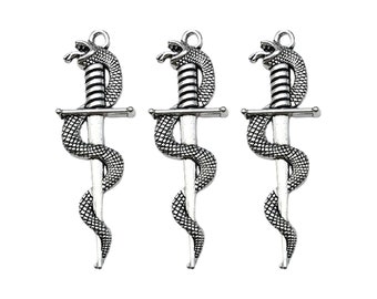 May include: Three silver-toned pendant charms featuring a snake wrapped around a dagger. The snake's head is raised and the dagger has a cross guard.