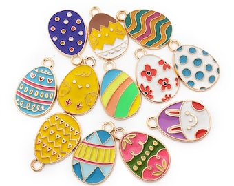 May include: Assortment of 12 gold-tone metal Easter egg charms with various colorful enamel designs, including polka dots, stripes, hearts, flowers, a chick, and a bunny.