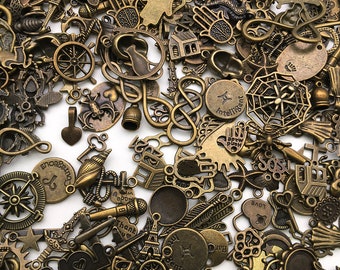 May include: A large collection of antique gold-toned metal charms, including a variety of shapes, symbols, and words. The charms are perfect for jewelry making, scrapbooking, and other craft projects.