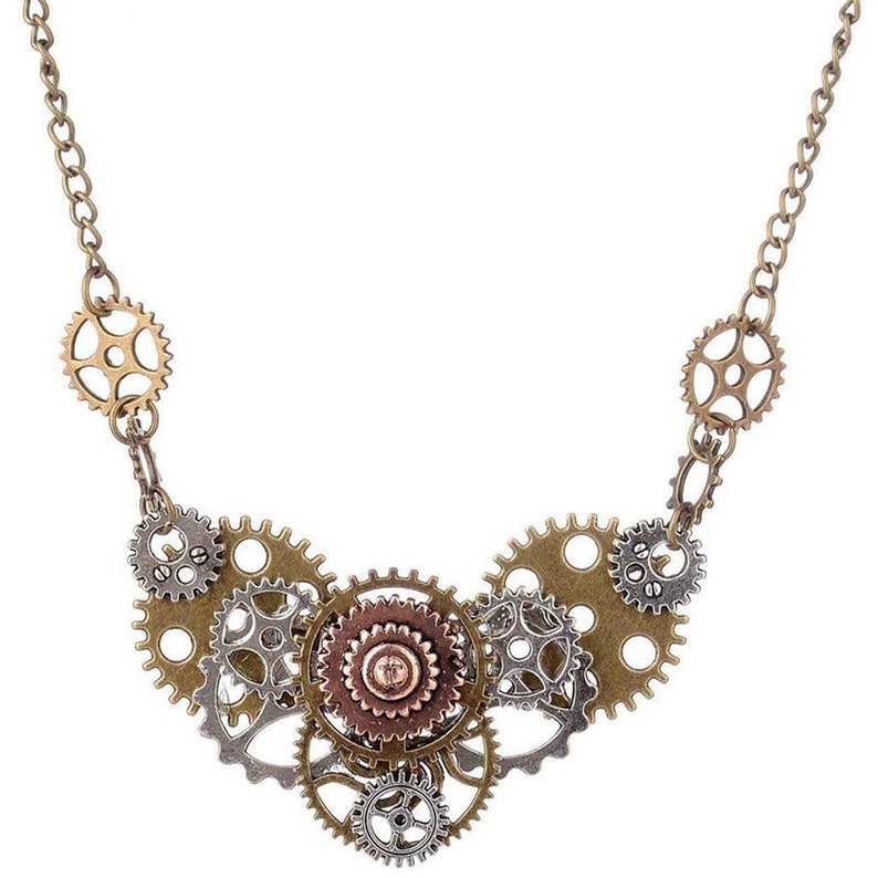 May include: A gold chain necklace with a pendant made of multiple interlocking gears in silver and bronze tones.