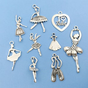 May include: A set of ten silver charm pendants featuring ballet dancers, a pair of ballet shoes, and a heart with the text "I Love Ballet".