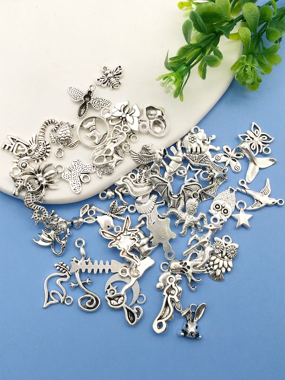 An Assorted Mix of 25 Silver Animal Charms