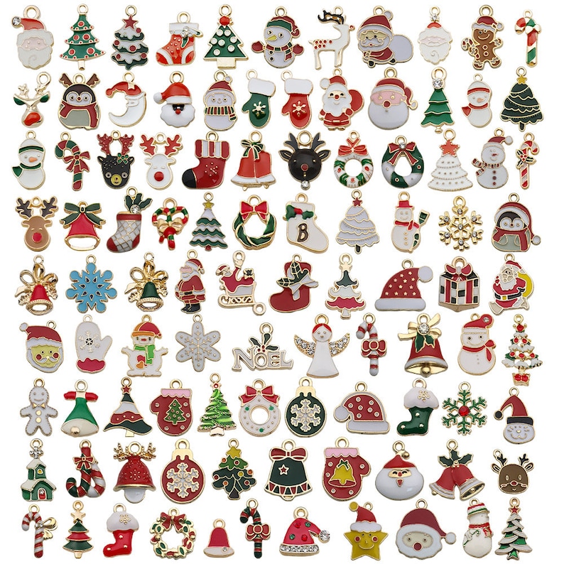 May include: Assortment of gold-tone Christmas charm pendants featuring various holiday themes, including reindeer, Santa Claus, snowmen, Christmas trees, candy canes, bells, and ornaments. The charms are decorated with colorful enamel paint and glitter.