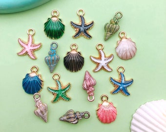 May include: Assortment of gold-tone charms featuring seashells and starfish in various colors, including blue, green, pink, and white. The charms are perfect for jewelry making or crafting.