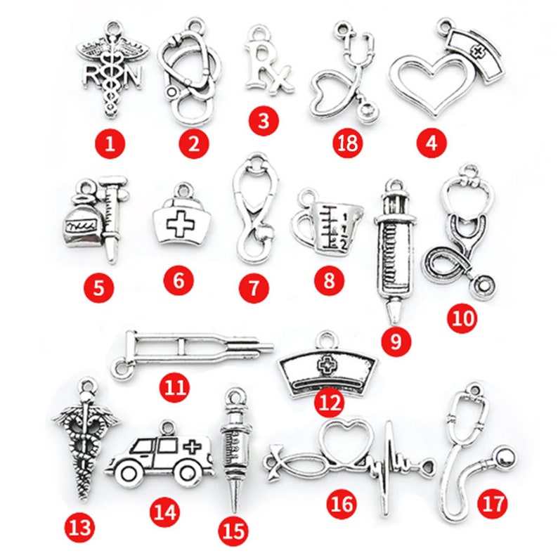 May include: A set of 17 silver-toned metal charms with various medical and nursing themes. The charms include a stethoscope, a heart, a syringe, a pill bottle, a nurse's hat, a medical symbol, a measuring cup, a crutch, an ambulance, and more.