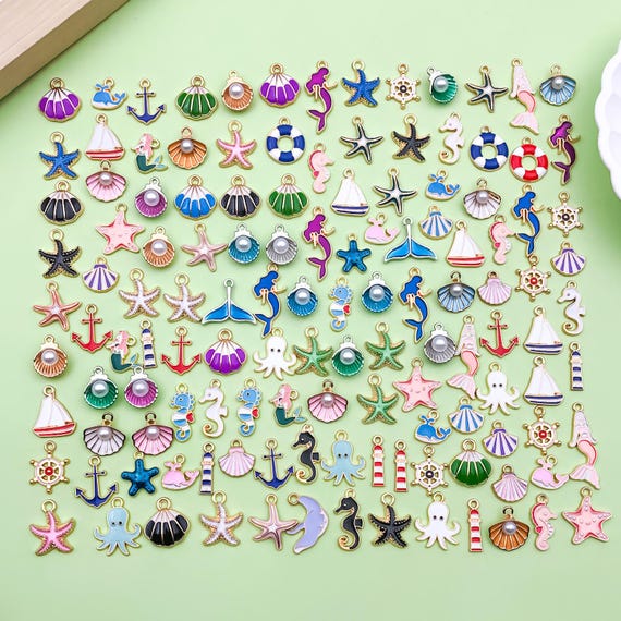 20/50/100 pezzi smaltati all'ingrosso a forma di stella marina, ciondolo a forma di conchiglia, per gioielli fai da te, da spiaggia, portachiavi, collane, orecchini, accessori artigianali - Italia