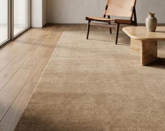 Beige handvävd matta, taupe neutral matta, minimalistisk ullmatta, modern skandinavisk vardagsrumsmatta, mjuk enfärgad golvmatta