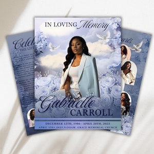 May include: Memorial cards featuring a woman's portrait, set against a backdrop of blue roses and doves. The cards display the text "IN LOVING Memory" and the name "Gabrielle Carroll", plus dates and a church.