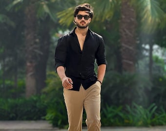 black dress shirt beige pants Men’s Black merino wool button up shirt with chest pocket. Black / Relaxed / M