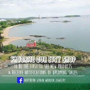 May include: Aerial view of a small island with a red lighthouse and a sandy beach. The text "FAVORITE OUR ETSY SHOP TO BE THE FIRST TO SEE NEW PRODUCTS & RECEIVE NOTIFICATIONS OF UPCOMING SALES + NORTHERN GRAIN WOODEN JEWELRY" is superimposed on the image.
