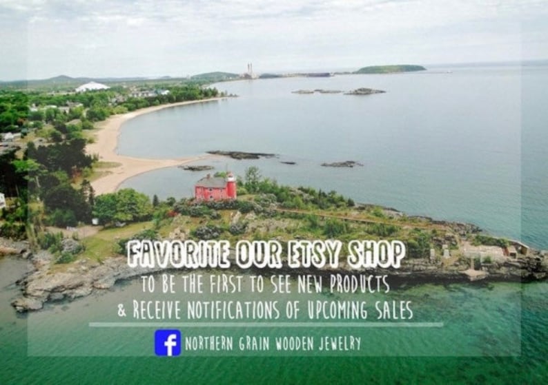 May include: Aerial view of a small island with a red lighthouse and a sandy beach. The text "FAVORITE OUR ETSY SHOP TO BE THE FIRST TO SEE NEW PRODUCTS & RECEIVE NOTIFICATIONS OF UPCOMING SALES + NORTHERN GRAIN WOODEN JEWELRY" is superimposed on the image.